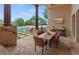 Outdoor patio with dining table, chairs, and a view of the pool at 10721 E La Junta Rd, Scottsdale, AZ 85255