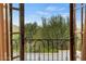 Spacious balcony offering scenic views of trees and distant mountains at 10721 E La Junta Rd, Scottsdale, AZ 85255