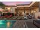 Luxury backyard with a pool, fire pit, and comfortable seating areas at 10721 E La Junta Rd, Scottsdale, AZ 85255
