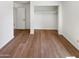 Bright bedroom featuring wood-look flooring and ample closet space at 4801 E Nisbet Rd, Scottsdale, AZ 85254