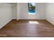 Simple bedroom with wood-look flooring and a window view at 4801 E Nisbet Rd, Scottsdale, AZ 85254