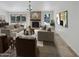 Bright living room with fireplace, tile floors, and access to backyard at 4801 E Nisbet Rd, Scottsdale, AZ 85254