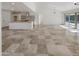 Modern kitchen island, white cabinets, and tile flooring at 4801 E Nisbet Rd, Scottsdale, AZ 85254