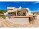 Outdoor kitchen and bar with backyard view at 10731 E Hillview St, Mesa, AZ 85207