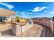 Outdoor kitchen with built-in grills and a pergola at 10731 E Hillview St, Mesa, AZ 85207