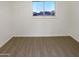 Bright bedroom with neutral carpeting and a large window at 5750 W Cortez St, Glendale, AZ 85304