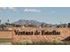 Entrance to Ventana de Estrellas community with mountain views at 18174 W Pima St, Goodyear, AZ 85338