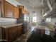 Modern kitchen with stainless steel appliances and wood cabinets at 8700 E University Dr # 339, Mesa, AZ 85207