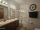 Bathroom with double vanity, shower, and linen storage at 8700 E University Dr # 339, Mesa, AZ 85207