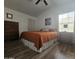 Bright bedroom with wood floors and a comfortable bed at 8700 E University Dr # 339, Mesa, AZ 85207