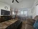 Spacious living room with hardwood floors, fireplace, and kitchen view at 8700 E University Dr # 339, Mesa, AZ 85207