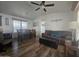 Open living and dining area with hardwood floors and ceiling fan at 8700 E University Dr # 339, Mesa, AZ 85207