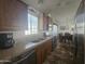 Bright kitchen boasts stainless steel appliances and a view to the dining area at 8700 E University Dr # 339, Mesa, AZ 85207
