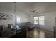 Living room with dining area, sofa, and ceiling fan at 8700 E University Dr # 339, Mesa, AZ 85207