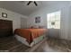 Relaxing bedroom with hardwood floors and a ceiling fan at 8700 E University Dr # 339, Mesa, AZ 85207