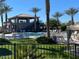 Community pool with lounge chairs and a clubhouse at 8700 E University Dr # 339, Mesa, AZ 85207
