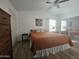 Bright bedroom with a queen bed, dresser, and ceiling fan at 8700 E University Dr # 339, Mesa, AZ 85207