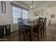 Charming dining room features a wood table and hardwood floors at 8700 E University Dr # 339, Mesa, AZ 85207