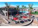 Community pool area with lounge chairs and fire pits at 8700 E University Dr # 339, Mesa, AZ 85207