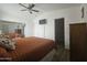Primary bedroom with a queen bed and mirrored closet at 8700 E University Dr # 339, Mesa, AZ 85207