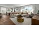 Spacious living room with large windows, and neutral color palette at 5910 S 246Th Ln, Buckeye, AZ 85326