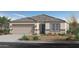 Single-story home with a two-car garage and desert landscaping at 5910 S 246Th Ln, Buckeye, AZ 85326