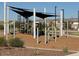 Modern playground with shade structures and play equipment at 5420 S 253Rd Ln, Buckeye, AZ 85326