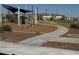 Community playground with shade structures and play equipment at 5420 S 253Rd Ln, Buckeye, AZ 85326