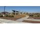 Community playground with shade structures and play equipment at 5420 S 253Rd Ln, Buckeye, AZ 85326