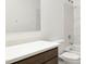 Modern bathroom vanity with white quartz countertop and dark brown cabinets at 5420 S 253Rd Ln, Buckeye, AZ 85326