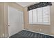 Bedroom with sliding door closet and window at 13055 W Eagle Talon Trl, Peoria, AZ 85383