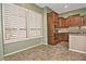 Bright kitchen with ample cabinet space and tile flooring at 13055 W Eagle Talon Trl, Peoria, AZ 85383