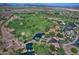 Community aerial view, featuring a golf course and clubhouse at 13055 W Eagle Talon Trl, Peoria, AZ 85383