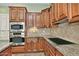 Spacious kitchen with stainless steel appliances and granite countertops at 13055 W Eagle Talon Trl, Peoria, AZ 85383