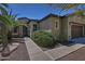 Front exterior view of single-story home with stone accents at 13055 W Eagle Talon Trl, Peoria, AZ 85383