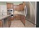 Modern kitchen with stainless steel appliances and granite countertops at 13055 W Eagle Talon Trl, Peoria, AZ 85383