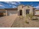 One-story home with a two-car garage and desert landscaping at 262 S 164Th Dr, Goodyear, AZ 85338