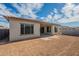 Back of house with tiled roof and large windows at 262 S 164Th Dr, Goodyear, AZ 85338