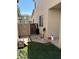 Side yard with gate and artificial turf at 1430 E Romley Ave, Phoenix, AZ 85040