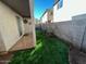 Small backyard with artificial turf and a patio at 1430 E Romley Ave, Phoenix, AZ 85040