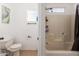 Clean bathroom with a shower/tub combo, toilet, and single sink at 1430 E Romley Ave, Phoenix, AZ 85040