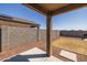 Covered patio overlooking a grassy backyard at 3719 E Henson St, San Tan Valley, AZ 85140