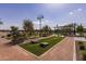 Community lawn games area with cornhole and benches at 3719 E Henson St, San Tan Valley, AZ 85140