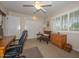 Home office with desk, chair, and built-in wooden shelving at 13408 N Cedar Dr, Sun City, AZ 85351