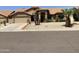 Single story home with tile roof and desert landscaping at 9510 W Menadota Dr, Peoria, AZ 85382
