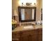 Bathroom with granite countertop, single sink and large mirror at 9510 W Menadota Dr, Peoria, AZ 85382