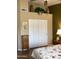 Bedroom with a large closet and wooden dresser at 9510 W Menadota Dr, Peoria, AZ 85382