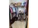 Spacious closet with ample shelving and hanging space for clothes and shoes at 9510 W Menadota Dr, Peoria, AZ 85382