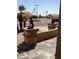 Landscaped front yard with mature palms and tile walkway at 9510 W Menadota Dr, Peoria, AZ 85382