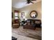 Spacious living room featuring brown leather sofa and large mirror at 9510 W Menadota Dr, Peoria, AZ 85382